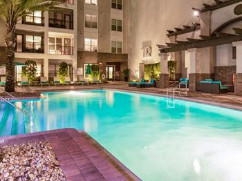 a large swimming pool in front of a building at The Rialto, Orlando, 32819